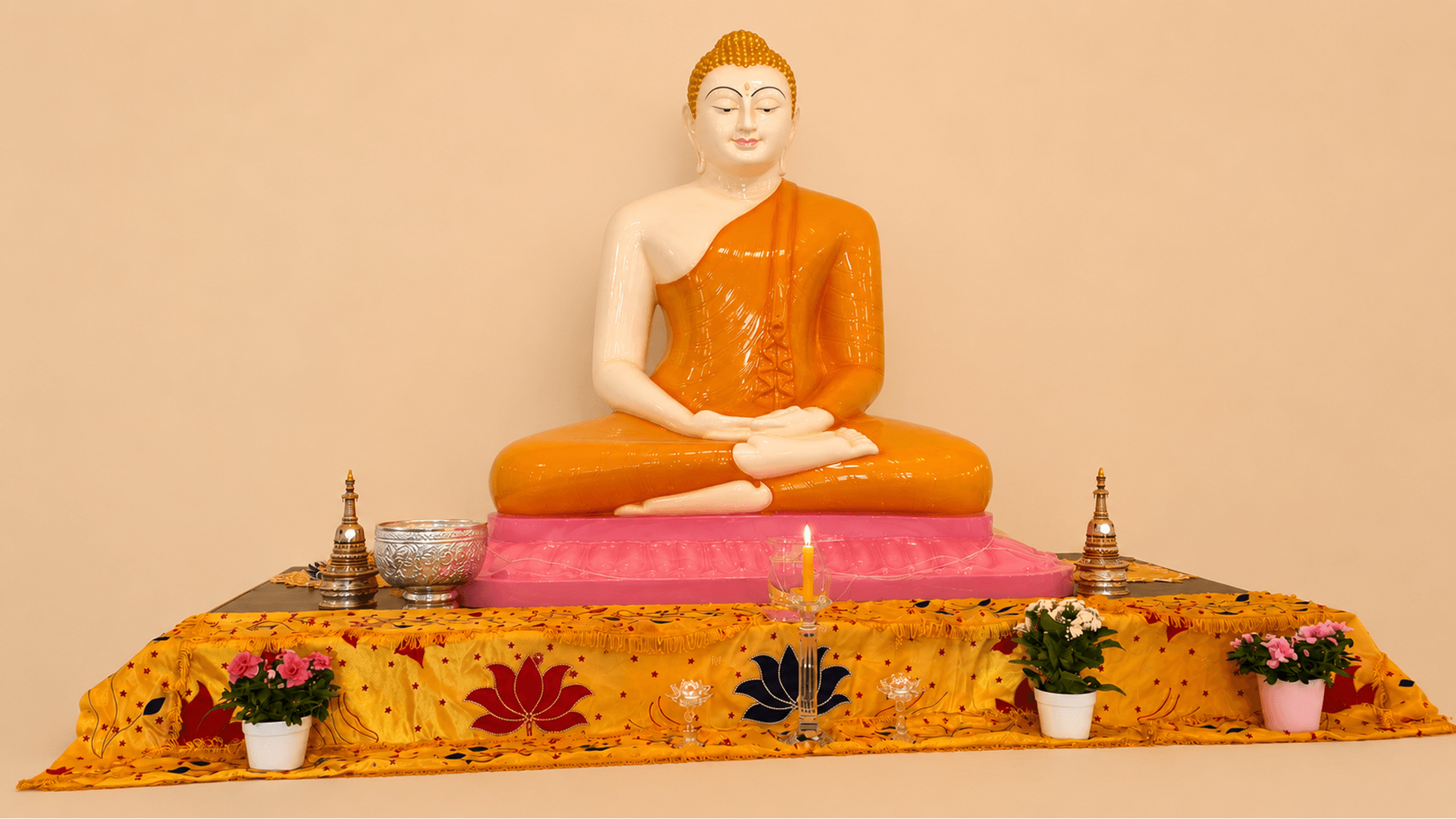 Serene stone Buddha statue surrounded by lush greenery at the Copenhagen Buddhist Vihara garden